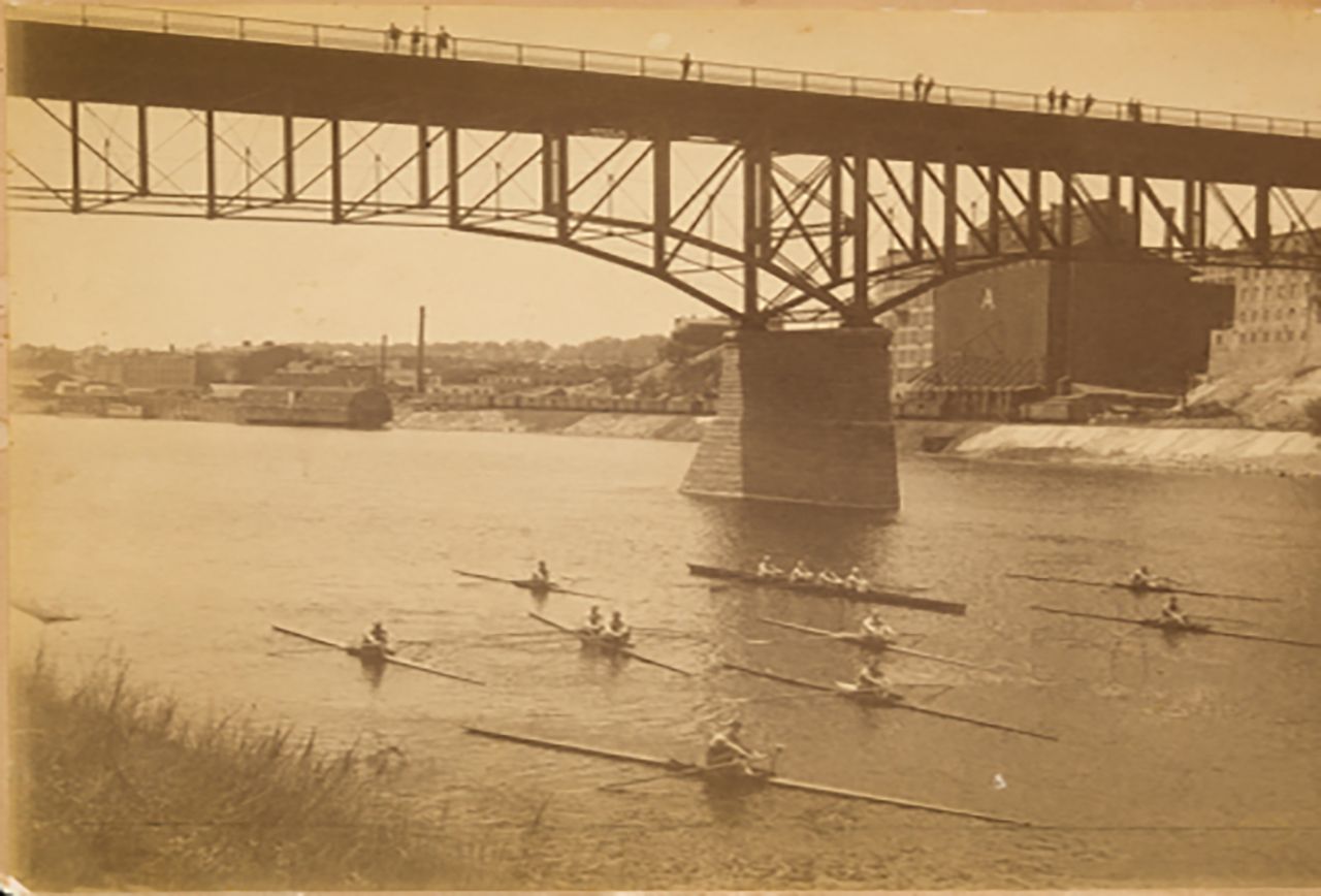 Old photograph of boaters gliding down Mississippi river